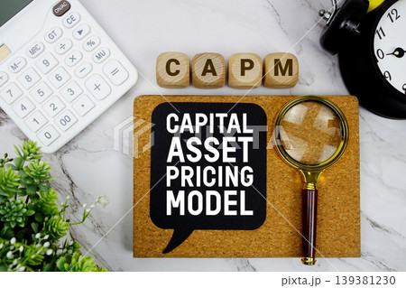 CAPM Capital Asset Pricing Model text with calculator, magnifying glass and alarm clock on marble background CAPM Capital Asset Pricing Model text with calculator, magnifying glass and alarm clock on marble background 139381230