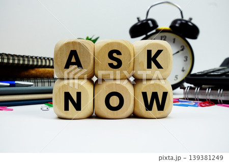 Ask Now alphabet letters with calculator and alarm clock on white background 139381249