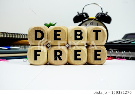 Debt Free alphabet letters with calculator and alarm clock on white background Debt Free alphabet letters with calculator and alarm clock on white background 139381270