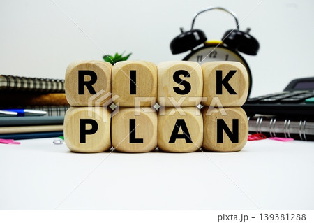 Risk Plan alphabet letters with calculator and alarm clock on white background 139381288