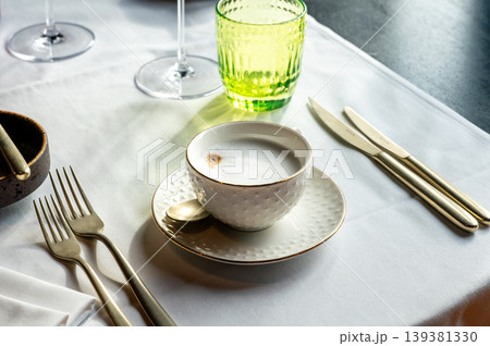 Morning coffee with refined details. Close perspective of refined coffee drink with delicate accessories Morning coffee with refined details. Close perspective of refined coffee drink with delicate accessories 139381330