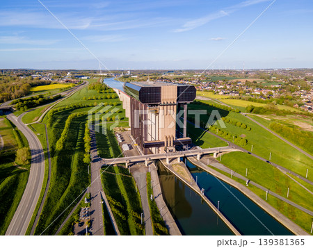 Drone shot of boat lift casting shadow over green spring valley Drone shot of boat lift casting shadow over green spring valley 139381365