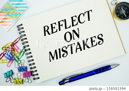 Reflect On Mistakes text message written on notepad with stationery flat lay on white background Reflect On Mistakes text message written on notepad with stationery flat lay on white background 139381394