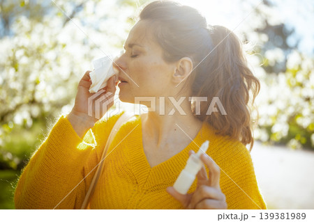 Outdoor Spring Allergy Management - Woman with Tissue Outdoor Spring Allergy Management - Woman with Tissue 139381989