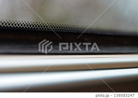 Rainy train window with raindrops and blurred winter trees outside. minimal travel scene with shallow depth of field, motion blur, and soft light. Rainy train window with raindrops and blurred winter trees outside. minimal travel scene with shallow depth of field, motion blur, and soft light. 139383247