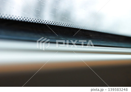 Rainy train window with raindrops and blurred winter trees outside. minimal travel scene with shallow depth of field, motion blur, and soft light. Rainy train window with raindrops and blurred winter trees outside. minimal travel scene with shallow depth of field, motion blur, and soft light. 139383248