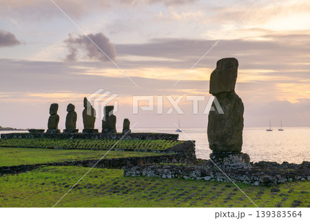 Majestic moai statue looks serene on easter island chile at dusk Majestic moai statue looks serene on easter island chile at dusk 139383564