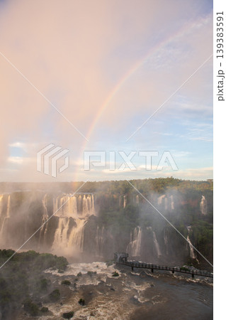 Breathtaking iguazu falls creating massive mist and bright rainbow Breathtaking iguazu falls creating massive mist and bright rainbow 139383591