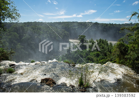 Majestic landscape view of mist at iguazu falls and green forest nature 139383592