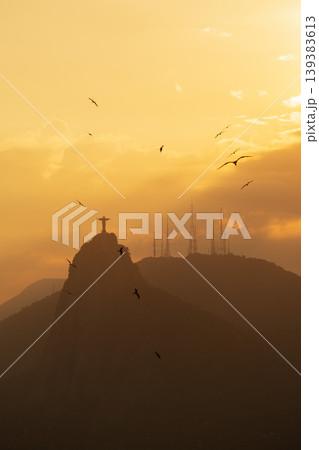 Serene silhouette of Christ Redeemer statue on Corcovado mountain at sunset over Rio de Janeiro Brazil majestic view Serene silhouette of Christ Redeemer statue on Corcovado mountain at sunset over Rio de Janeiro Brazil majestic view 139383613