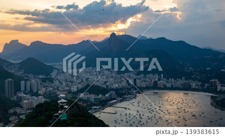 Peaceful sunset over Rio de Janeiro cityscape and mountain silhouette. beautiful aerial view of brazilian city bay 139383615