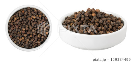 Black peppercorns or pepper in a ceramic bowl isolated on a white background. Top view. Flat lay Black peppercorns or pepper in a ceramic bowl isolated on a white background. Top view. Flat lay 139384499