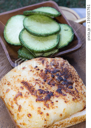 a decadent, cheese-crowned toastie, its surface transformed into a mosaic of molten ivory and deep, toasted amber. This savory warmth is perfectly balanced by a hand-carved wooden bowl filled with a decadent, cheese-crowned toastie, its surface transformed into a mosaic of molten ivory and deep, toasted amber. This savory warmth is perfectly balanced by a hand-carved wooden bowl filled with 139385761