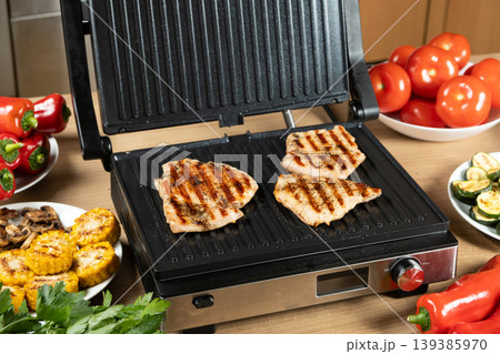 Juicy Turkey Fillet Steaks Sizzling on Electric Contact Grill Juicy Turkey Fillet Steaks Sizzling on Electric Contact Grill 139385970