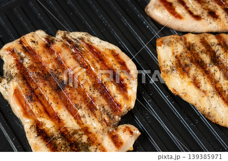 Grilled Turkey Steaks with Perfect Brown Grill Marks Close-up 139385971