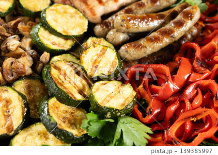 Healthy BBQ platter featuring roasted corn, zucchini and poultry Healthy BBQ platter featuring roasted corn, zucchini and poultry 139385997