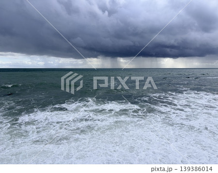 seascape rain and strong wind over the sea with waves 139386014