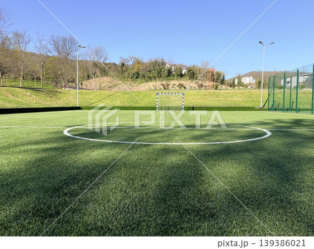 A pristine, outdoor artificial turf soccer field on a bright, sunny day A pristine, outdoor artificial turf soccer field on a bright, sunny day 139386021