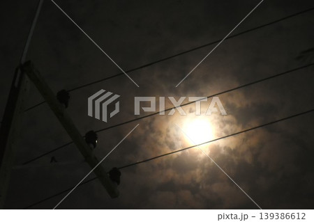 electric pole and cable with full moon on cloud in night electric pole and cable with full moon on cloud in night 139386612