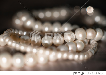 Luxury pearl strands on gray background, elegant jewelry texture. Luxury pearl strands on gray background, elegant jewelry texture. 139386617