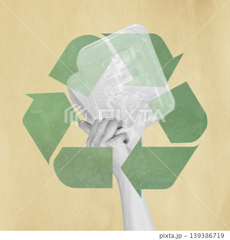 Hand holding plastic waste with recycling symbol 139386719