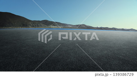 Empty asphalt road stretching towards mountain lake horizon 139386729