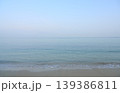Calm clear sea meeting sandy beach horizon 139386811