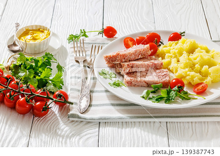 Slices of classic head cheese with mashed potatoes Slices of classic head cheese with mashed potatoes 139387743