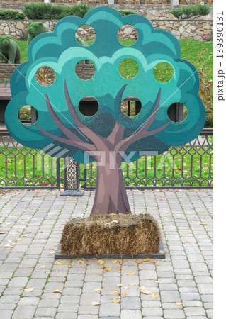 Tree cutout for fun in outdoor activity area 139390131