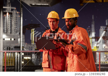 Team of engineers inspecting drilling rig activity at night, ensuring efficient oil and natural fuel extraction from offshore platform. Working together on oil production for the industry. Team of engineers inspecting drilling rig activity at night, ensuring efficient oil and natural fuel extraction from offshore platform. Working together on oil production for the industry. 139390240