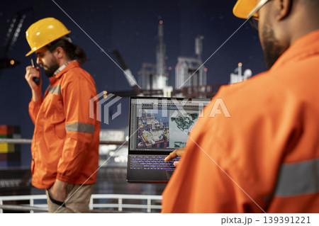Close up of offshore platform exploration specialist reviewing geological survey data on digital mapping interface. Technician evaluating seabed topography maps for site assessment planning Close up of offshore platform exploration specialist reviewing geological survey data on digital mapping interface. Technician evaluating seabed topography maps for site assessment planning 139391221