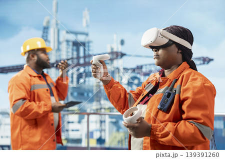 Woman on offshore platform engineer wearing VR goggles gear coordinating operation logistics. Drilling rig crew operator using virtual reality technology, documenting safety inspections 139391260