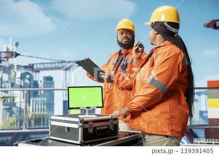 Green screen mockup tablet used by offshore platform engineers monitoring environmental impact. Drilling ship employees working on chroma key device, taking marine ecosystem protection measures 139391405