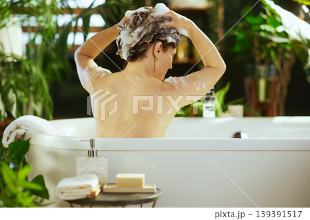 Woman Washing Hair in Bathtub - Serene Routine Woman Washing Hair in Bathtub - Serene Routine 139391517