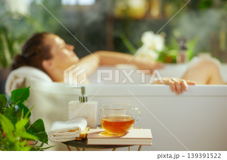 Relaxing Home Spa Bath with Tea and Books 139391522