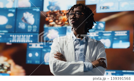Portrait of healthcare researcher analyzing futuristic medical data visualizations, doing disease prevention. Scientist doing research development using high tech patient scans, camera B Portrait of healthcare researcher analyzing futuristic medical data visualizations, doing disease prevention. Scientist doing research development using high tech patient scans, camera B 139391568