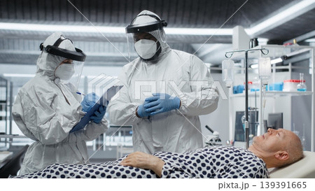 Scientists working in a virology unit with lab testing on infected patient, studying bacteria and immune response for disease prevention and treatment breakthrough. Prevention center. Camera B. 139391665