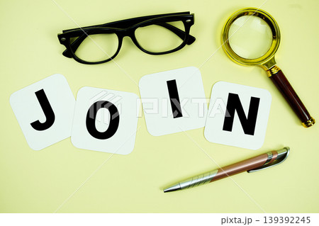 JOIN alphabet letters with magnifying glass, eye glasses and pen on yellow background JOIN alphabet letters with magnifying glass, eye glasses and pen on yellow background 139392245