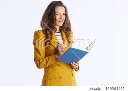 Focused Businesswoman with Notebook and Pen Focused Businesswoman with Notebook and Pen 139393465