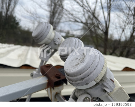 Adjusting satellite dish signal on rooftop 139393598