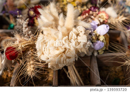 Rustic dried flower bouquets with wheat lagurus and grasses craft market Rustic dried flower bouquets with wheat lagurus and grasses craft market 139393720