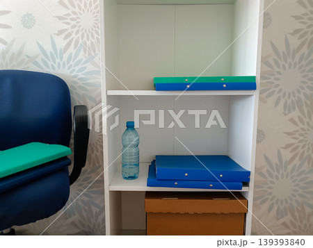 Organized Office Shelf with Folders and Files 139393840