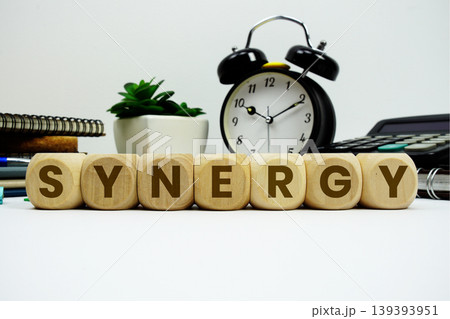 SYNERGY alphabet letters with alarm clock and calculator on white background SYNERGY alphabet letters with alarm clock and calculator on white background 139393951