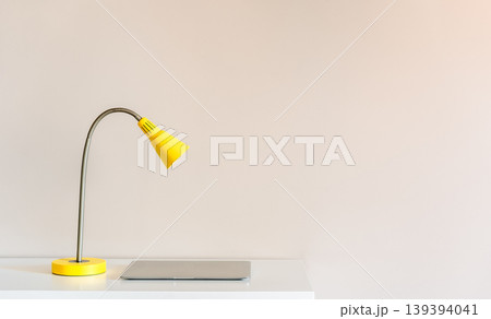Minimal interior with yellow desk lamp and chair Minimal interior with yellow desk lamp and chair 139394041