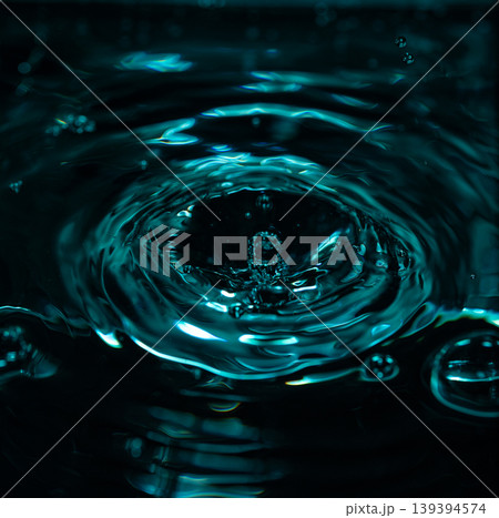 345.Crown Splash and Ripples on Teal-Blue Water Surface 345.Crown Splash and Ripples on Teal-Blue Water Surface 139394574