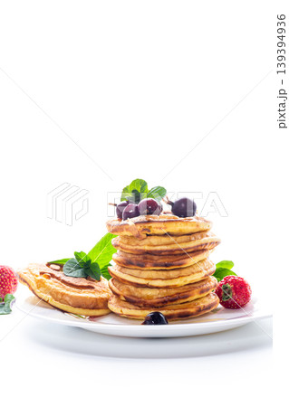 Homemade pancakes with strawberry and grapes on clean white background Homemade pancakes with strawberry and grapes on clean white background 139394936