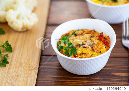 homemade cauliflower omelet with parsley on rustic wooden table 139394940