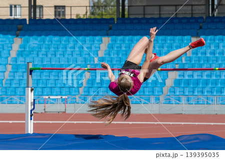 Successful high jump attempt Successful high jump attempt 139395035