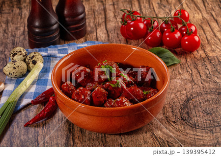 Appetizing Meatballs in Rich Tomato Sauce with Fresh Ingredients on Wooden Table Appetizing Meatballs in Rich Tomato Sauce with Fresh Ingredients on Wooden Table 139395412