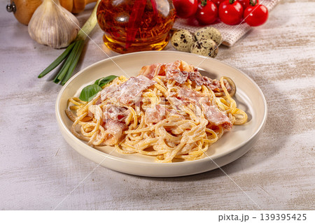 Homemade spaghetti carbonara, rich creamy sauce, crispy bacon, fresh basil Homemade spaghetti carbonara, rich creamy sauce, crispy bacon, fresh basil 139395425